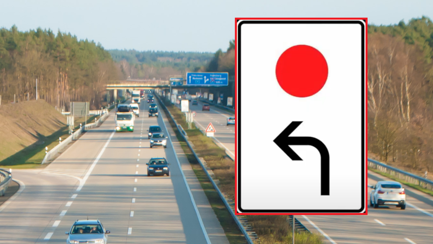 Znak drogowy z czerwoną kropką na białym tle