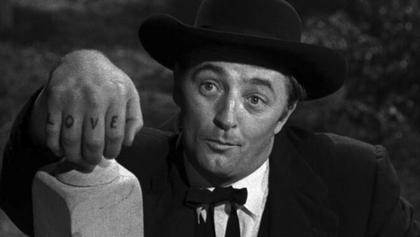 Robert Mitchum jako Henry Powell w filmie "Noc myśliwego"