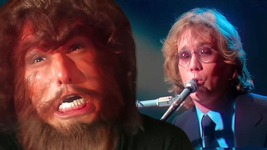 Na zdjęciu widać mężczyznę z bujną fryzurą i brodą oraz drugiego grającego na instrumentach muzycznych