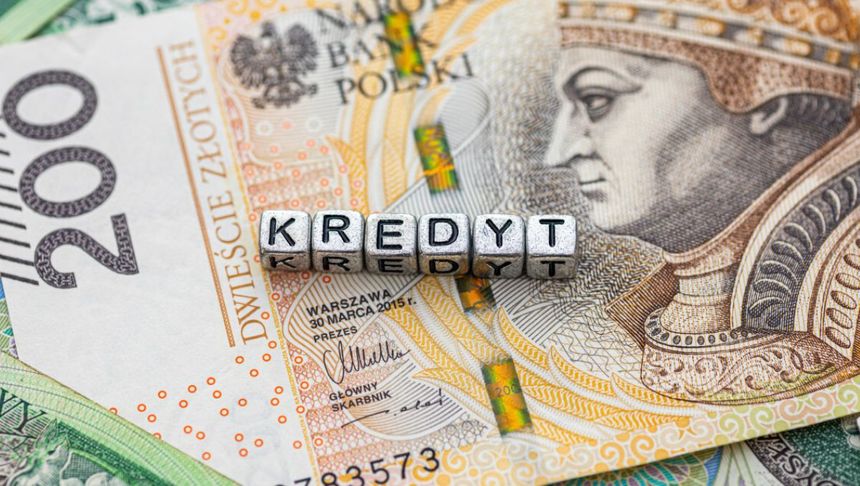 Pieniądze w tle napisu kredyt