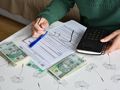 pieniądze, notes i kalkulator