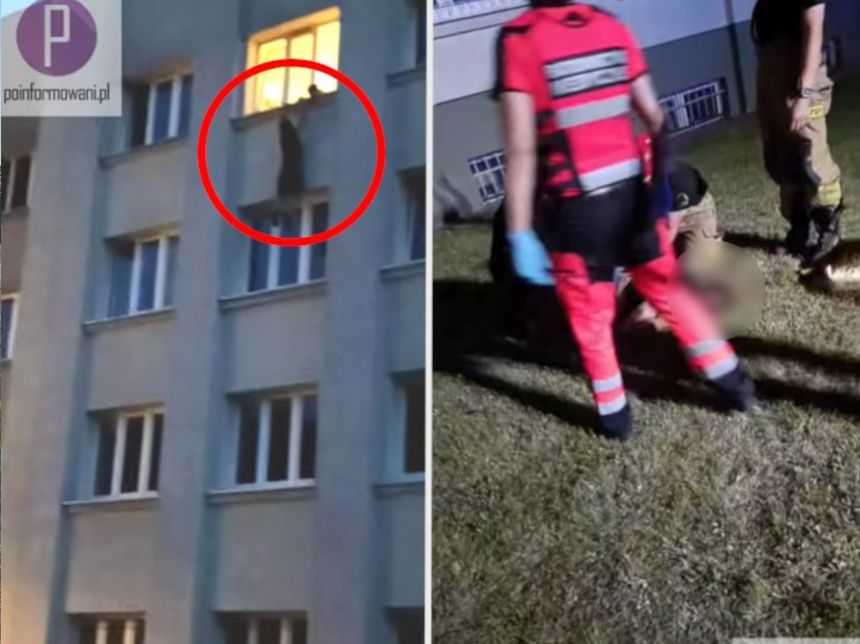 Mężczyzna wiszący w oknie budynku
