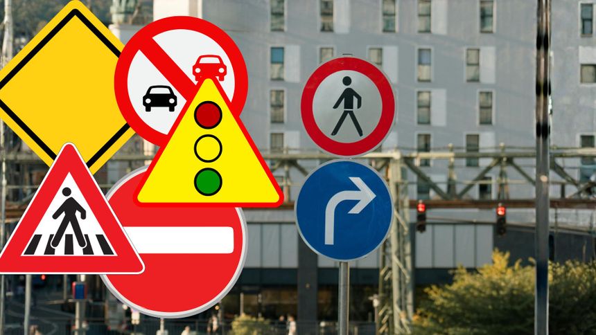 Zestaw różnych znaków drogowych na tle miejskiego krajobrazu.