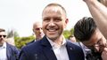 Uśmiechnięty Nawrocki po roku prezydentury