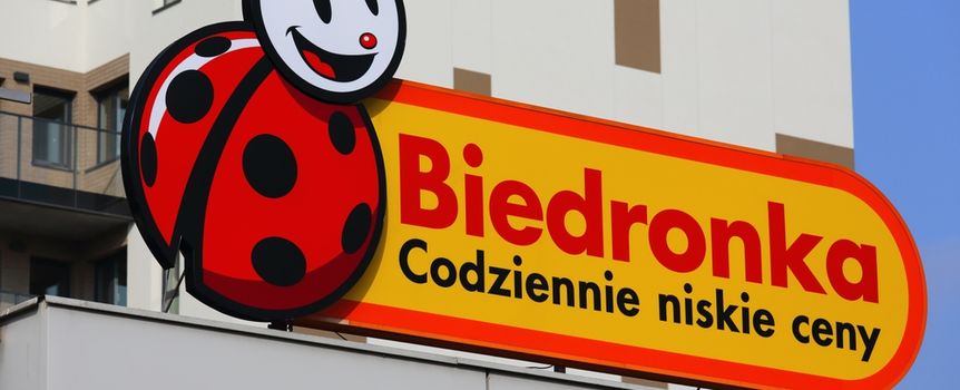 Logo Biedronki z uśmiechniętą biedronką i napisem 