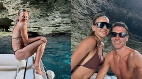 Anna Lewandowska, Robert Lewandowski w okularach przeciwsłonecznych na łódce w jaskini nad wodą. Słońce odbija się w wodzie.