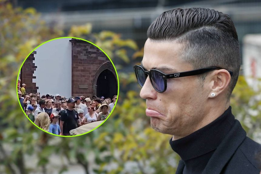 Na zdjęciu Cristiano Ronaldo w czarnych okularach przeciwsłonecznych, w tle tłum ludzi.