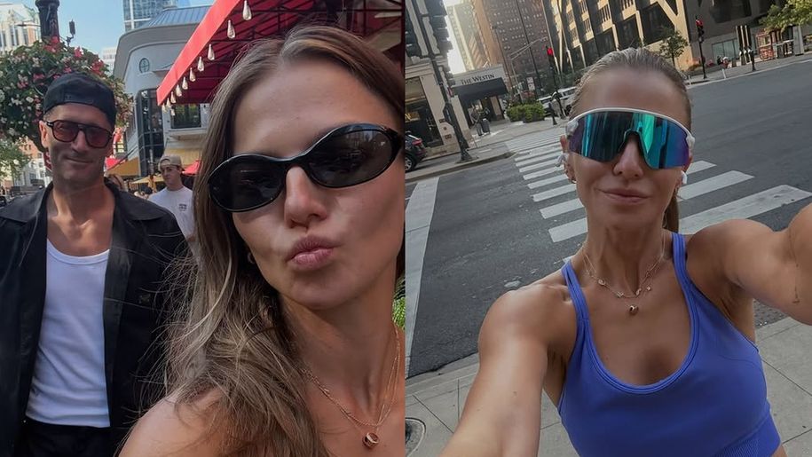 Anna Lewandowska robi selfie w mieście, w tle budynki i przechodnie.