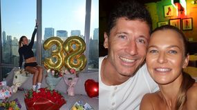 Anna Lewandowska siedzi w pomieszczeniu z widokiem na miasto, obok balony „38” i bukiety kwiatów.