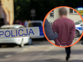 Na zdjęciu widać taśmę policyjną oraz osobę aresztowaną w niebieskim otoczeniu.