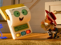 Na zdjęciu widoczna jest postać w kowbojskim stroju, uśmiechający się robot.