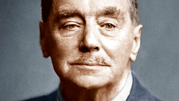 H.G. Wells. Twarz mężczyzny w garniturze, neutralne tło, lekki uśmiech.